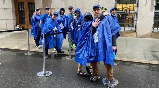 Rain or shine, Dave Roberts (right) has been a stalwart Commencement volunteer for 20+ years.