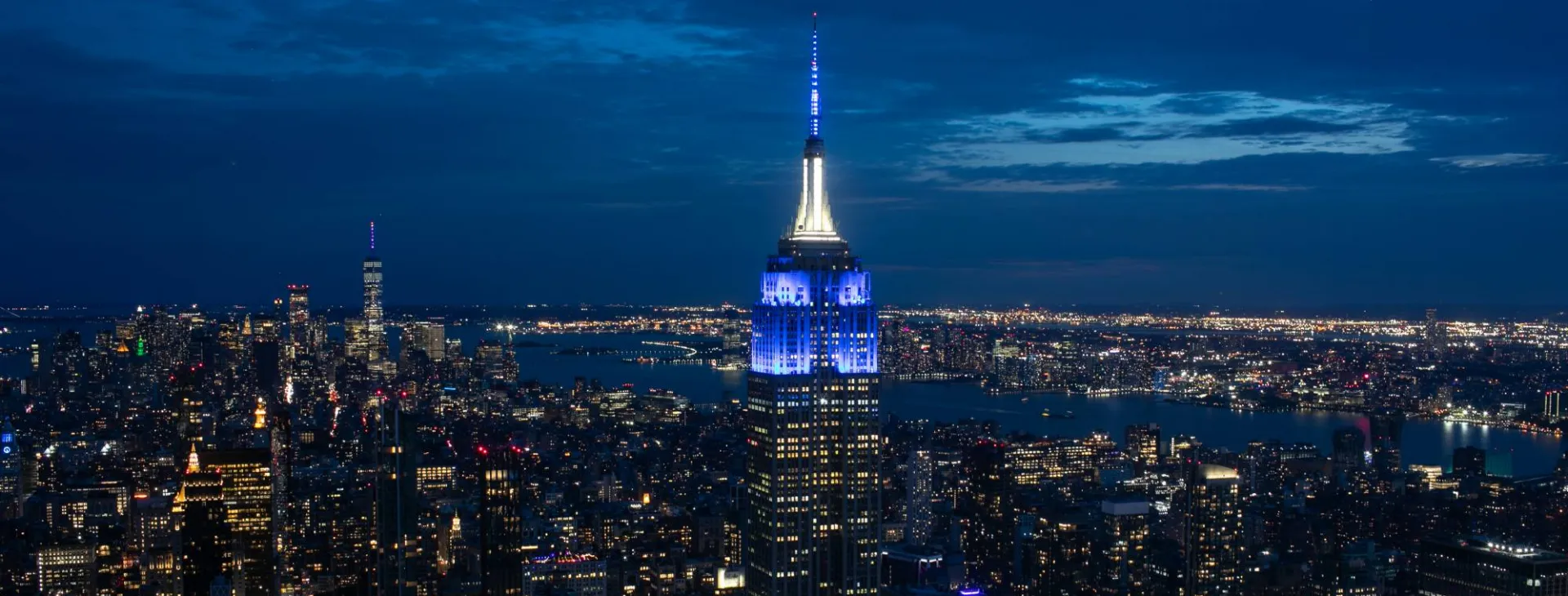 The Empire State Building lit up in blue and white honoring Columbia graduates.