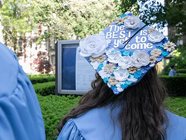 Grad mortarboard decorated with the text "The best is yet to come"