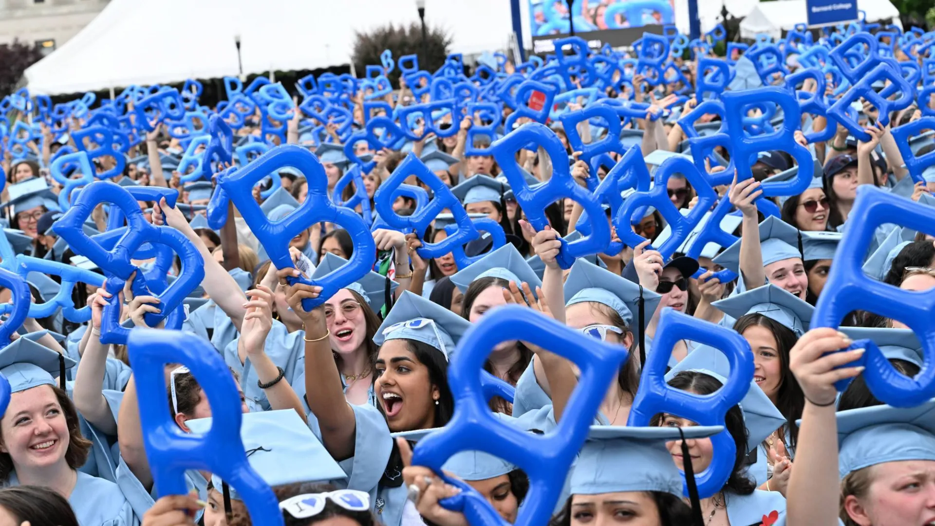 Barnard graduates cheering in the crowd. Photo by Diane Bondareff.