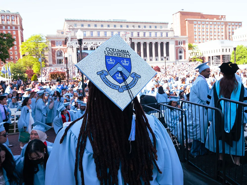 Student overlooking low plaza. Image by Sirin Samman.