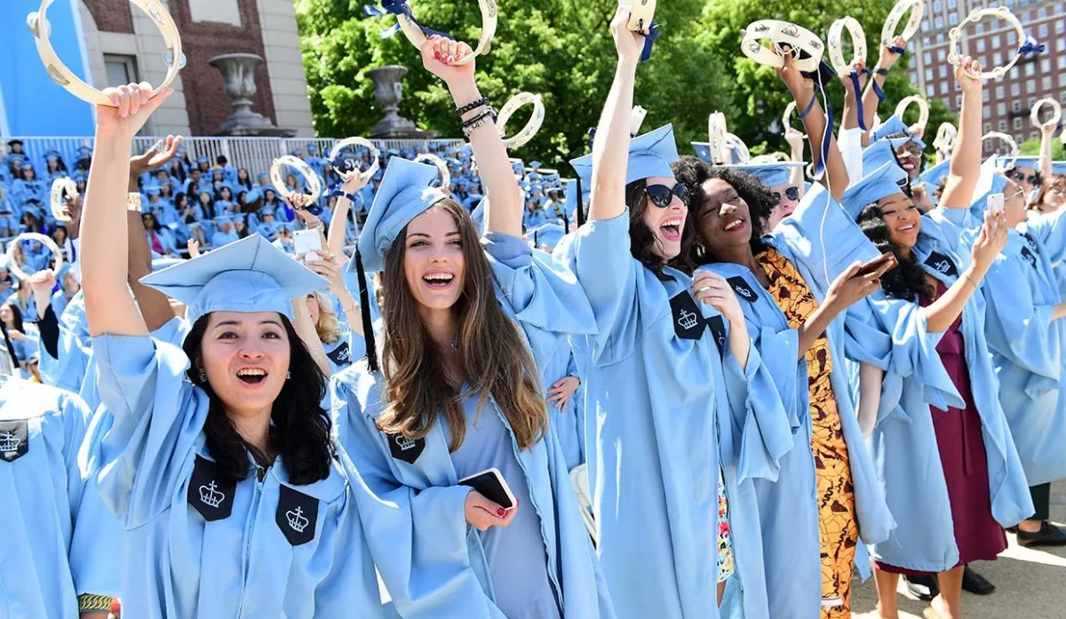 School of the Arts graduates shaking tambourines