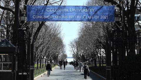 Campus gates leading to Morningside campus with a banner that reads: Columbia University, Congratulations to the class of 2021