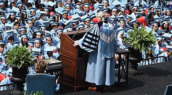 President Bollinger addresses tens of thousands of guests and graduating Columbia students in light blue caps and gowns.