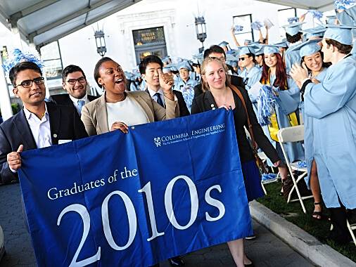 Columbia grads holding a 2010 banner