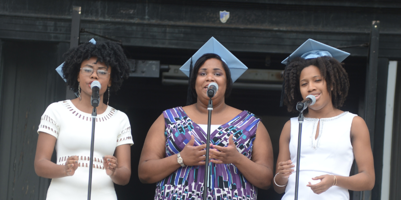 2014 graduating students singing at university commencement