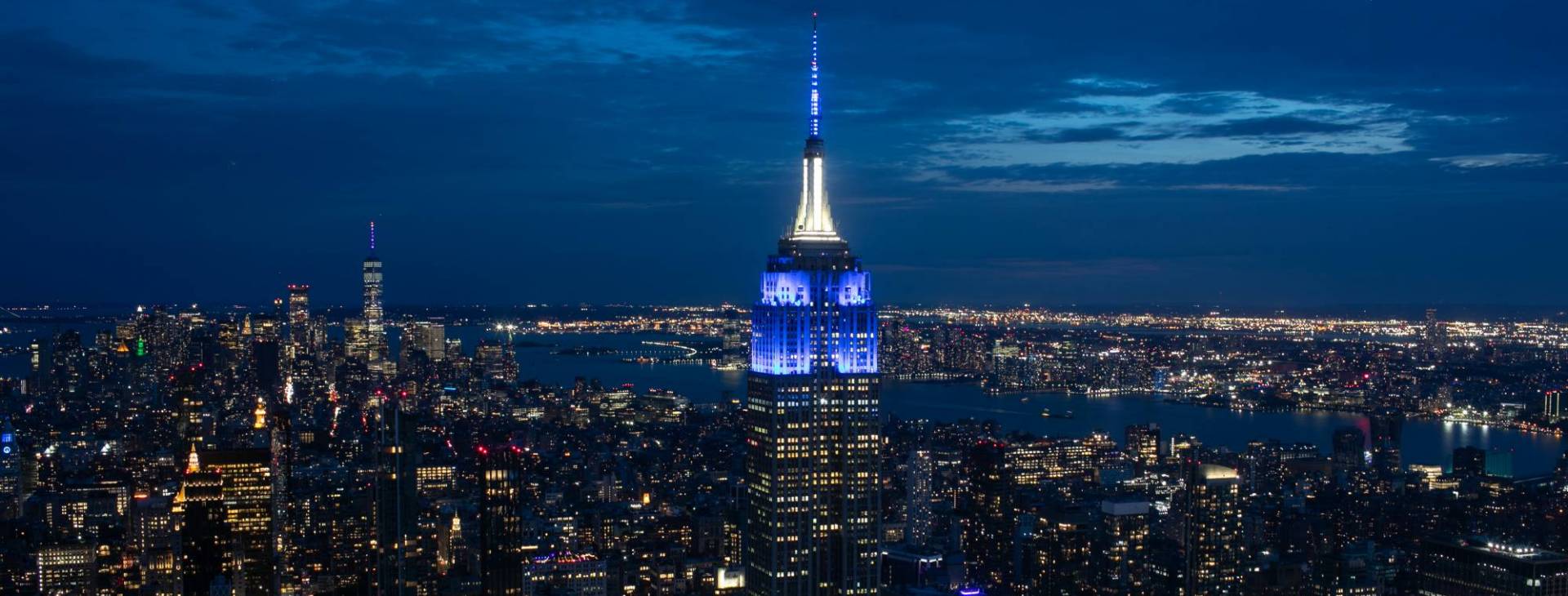 The Empire State Building lit up in blue and white honoring Columbia graduates.
