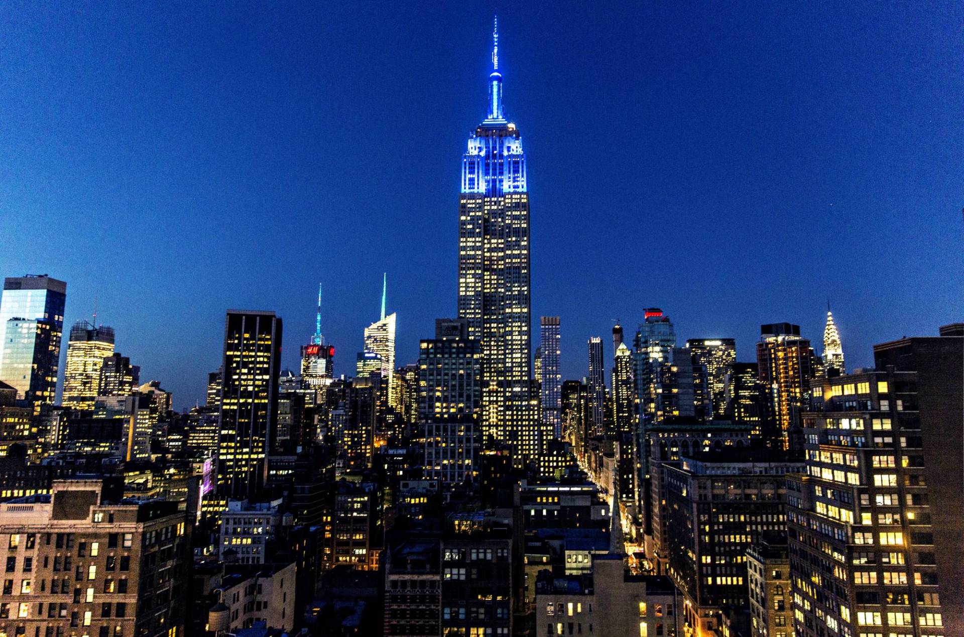 Empire State Building lit up in blue.