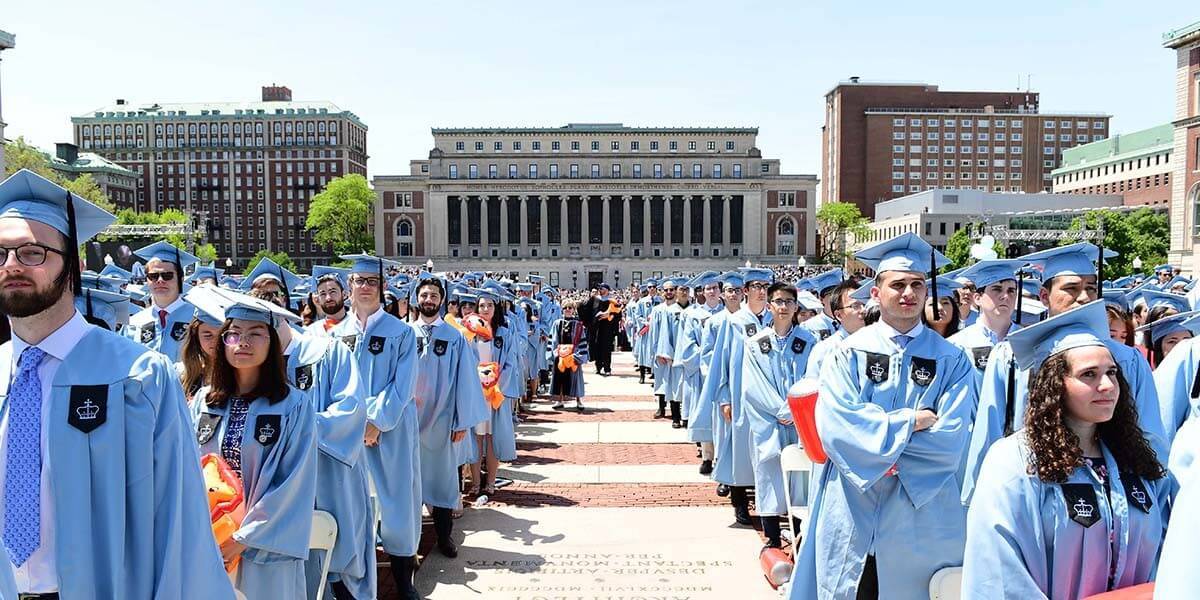 Graduating Students with Butler Library in the background