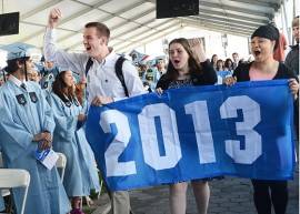 Columbia grads holding a 2013 banner
