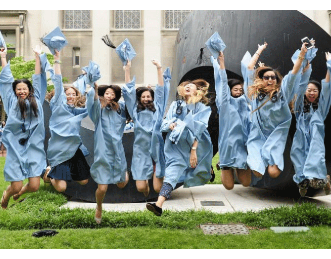 graduates jumping in the air